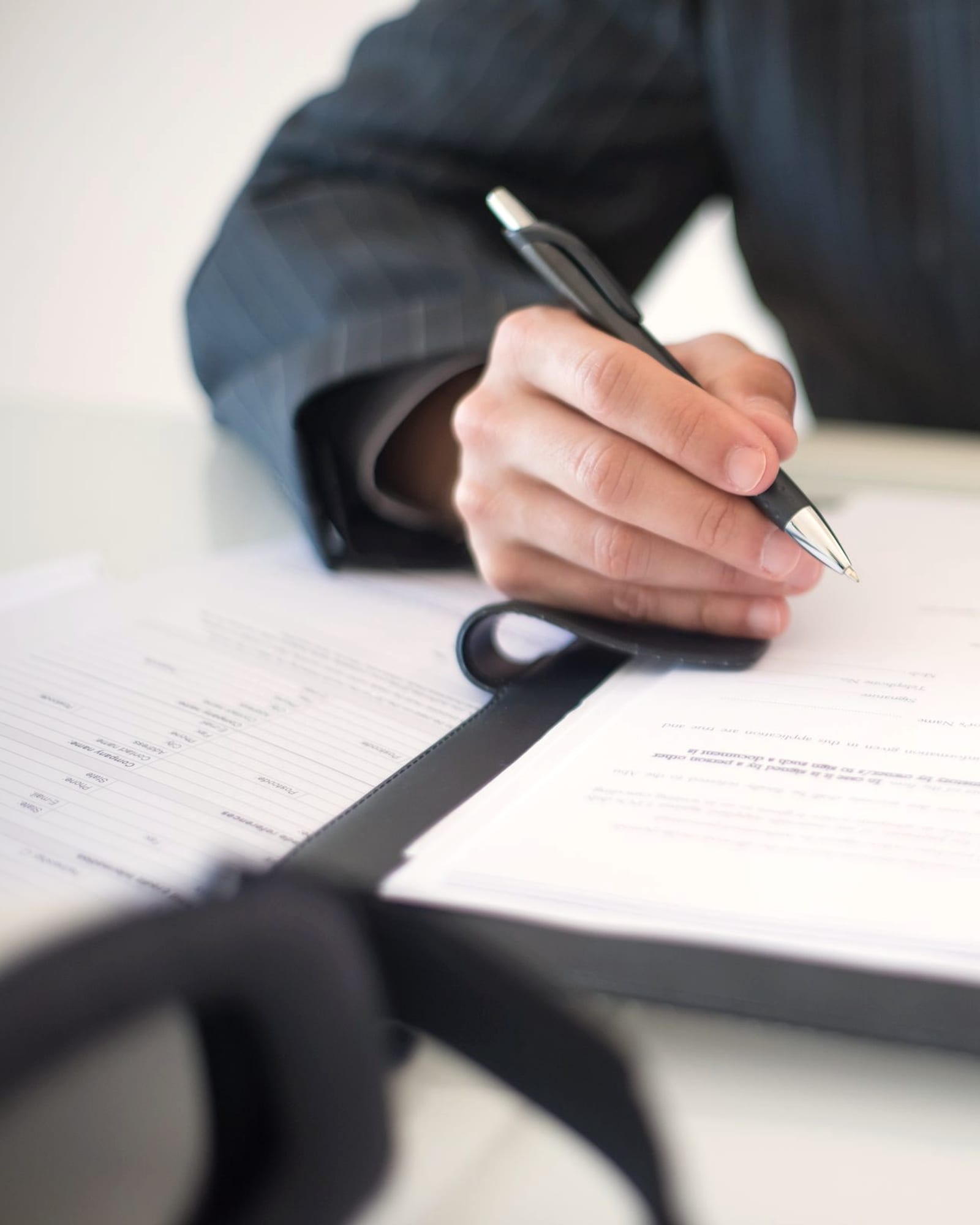 Working through a client’s paperwork at the desk