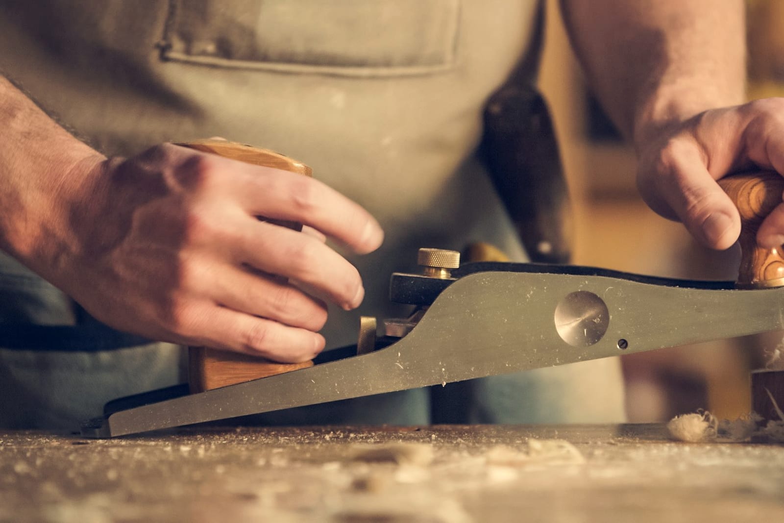 A tradesperson working at a bench